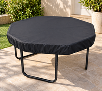 Black weather-resistant Tuff Tray Cover fitted snugly over a full-size tuff tray and stand outdoors