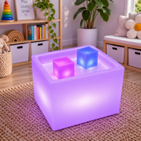Sensory Mood Play Cube lit in purple, showing the flat glowing surface that doubles as a light tracing table